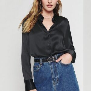 Reformation 	
In new condition 
Sky Silk Top